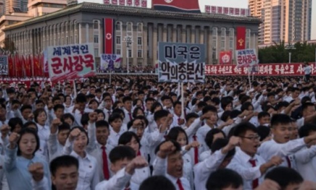 Students march during a mass rally on Kim Il-Sung Square in Pyongyang on September 23, 2017 to laud leader Kim Jong-Un's denounciation of US President Donald Trump - AFP