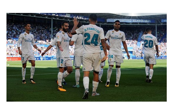 Dani Ceballos with Real Madrid players in Alaves match, REUTERS