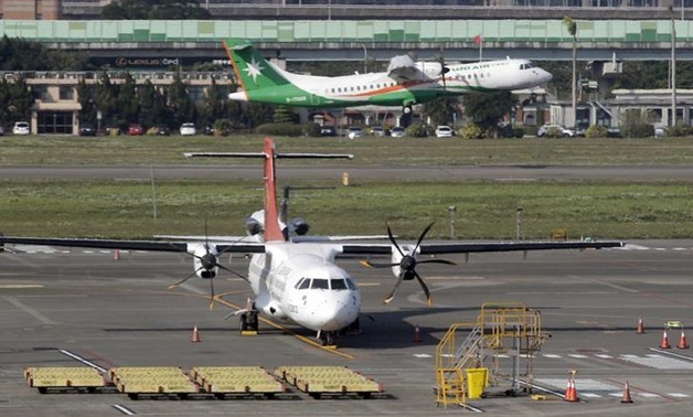 A TransAsia Airways ATR airplane is seen parked at Taipei Songshan Airport February 13, 2015. REUTERS
