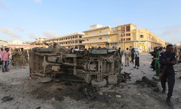 Somali security officers secure the scene of a car explosion in Hamarweyne district of Mogadishu - REUTERS