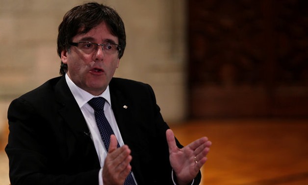 Catalan President Puigdemont gestures during an interview with Reuters ahead of the banned October 1 independence referendum, in Barcelona - REUTRERS
