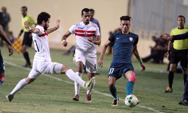 Zamalek players trying to stop Enppi`s player, file photo from superkora.football