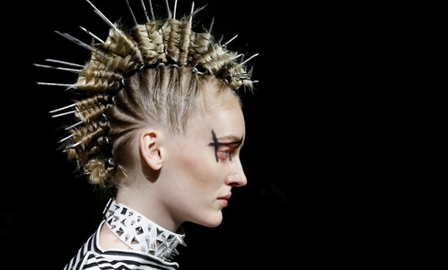 Japan's Junya Watanabe wowed critics with his startling sculptural black-and-white collections with a punky twist -AFP
