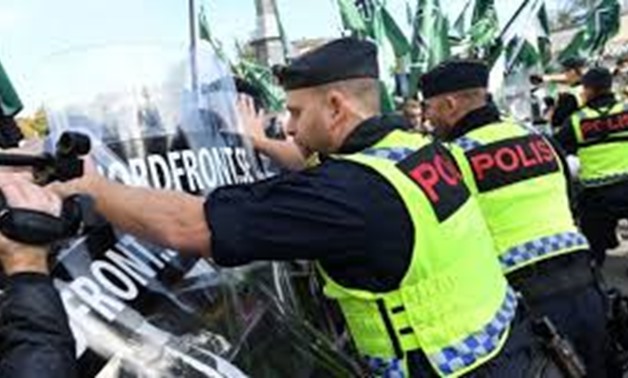 Swedish police arrest dozens at Neo-Nazi rally - Press Photo