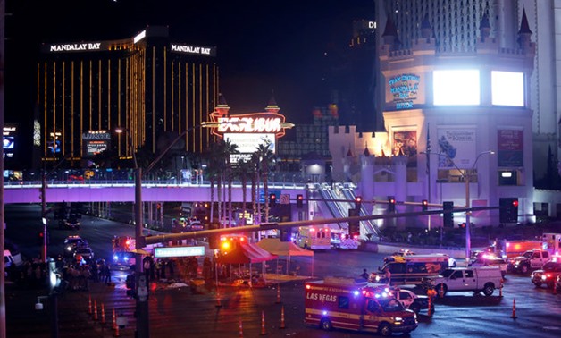 Las Vegas Metro Police and medical workers stage in the intersection of Tropicana Avenue and Las Vegas Boulevard South after a mass shooting at a music festival on the Las Vegas Strip in Las Vegas, Nevada, U.S. October 1, 2017. REUTERS/Las Vegas Sun/Steve
