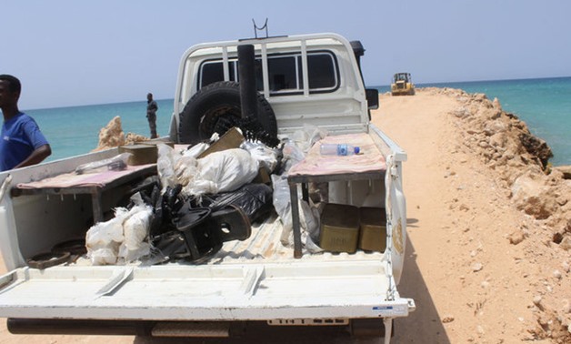 Somali Puntland forces display weapons seized on a boat on the shores of the Gulf of Aden in the city of Bosasso - REUTERS