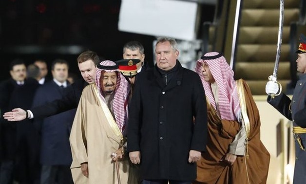 Saudi Arabia's King Salman (2nd L) stands next to Russian Deputy Prime Minister Dmitry Rogozin (2nd R) during a welcoming ceremony upon his arrival at Vnukovo airport outside Moscow, Russia October 4, 2017. REUTERS