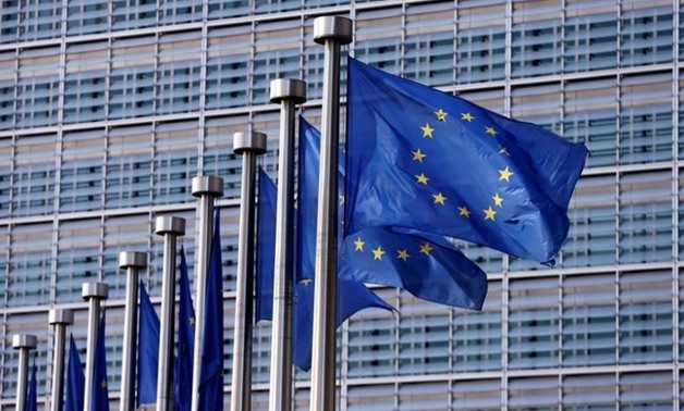 European Union flags flutter outside the EU Commission headquarters in Brussels, Belgium - REUTERS