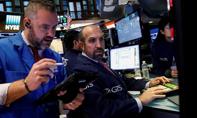 Traders work on the floor of the New York Stock Exchange (NYSE) in New York, U.S., October 3, 2017. REUTERS/Brendan McDermid