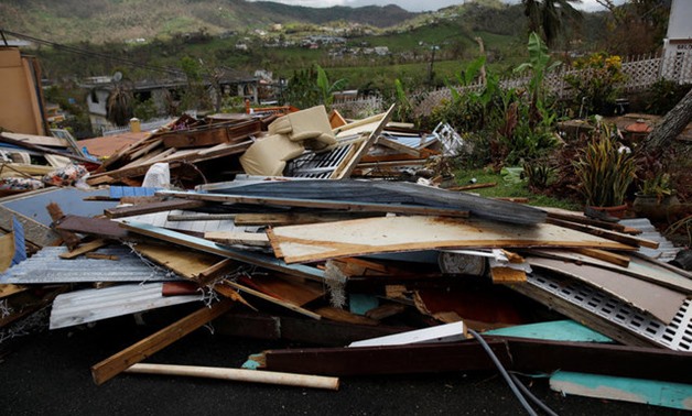 Debris is seen outside a home damaged by Hurricane Maria is seen in the Trujillo Alto municipality outside San Juan, Puerto Rico, October 9, 2017. REUTERS