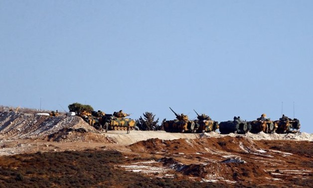 Turkish armoured military vehicles patrol on the Turkish-Syrian border line in Reyhanli, Hatay province, Turkey, October 8, 2017. REUTERS/Osman Orsal