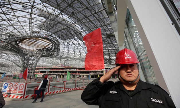  A security guard salutes at the terminal hall of new Daxing Airport constructed on the outskirts of Beijing October 16, 2017. — Reuters pic