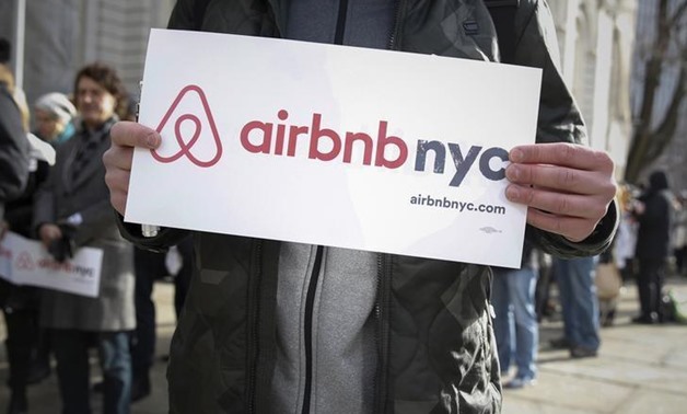 Supporters of Airbnb stand during a rally before a hearing called "Short Term Rentals: Stimulating the Economy or Destabilizing Neighborhoods?" at City Hall in New York January 20, 2015. REUTERS