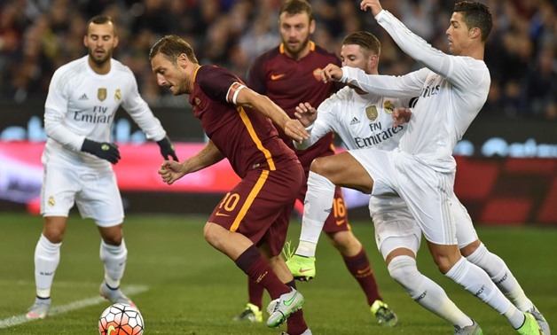Cristiano Ronaldo tackles Francesco Totti, Reuters