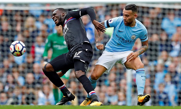 Crystal Palace's Christian Benteke in action with Manchester City's Nicolas Otamendi - REUTERS