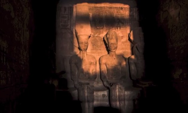 A stream of sunlight glazing the statuettes of Ramses, Ra and Amun in the central chamber; except for Ptah’s statue, the goddess of darkness – Courtesy from YouTube