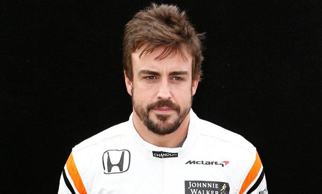 McLaren driver Fernando Alonso of Spain poses during the driver portrait session at the first race of the year. REUTERS