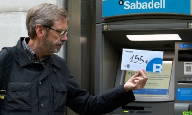 Catalan separatists have starting withdrawing cash from banks - AFP/File / by Katy Lee in Madrid with Marie Giffard in Barcelona 
