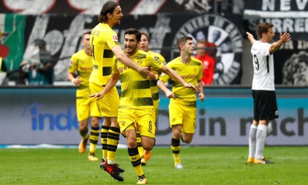 Borussia Dortmund’s Nuri Sahin celebrates scoring their first goal with Neven Subotic and team mates REUTERS
