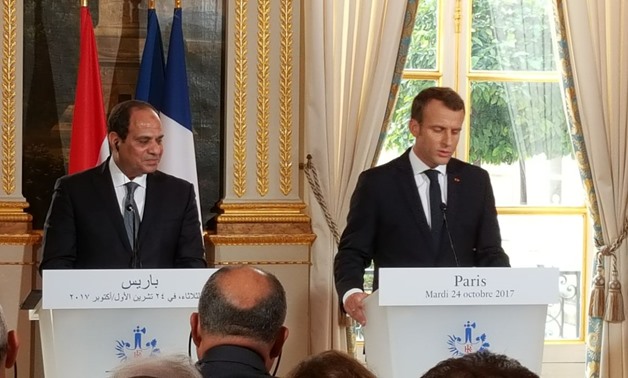 File Photo: French President Emmanuel Macron (R) and Egypt's President Abdel-Fattah al-Sisi attend a press conference at the Elysee Palace in Paris on October 24, 2017. REUTERS