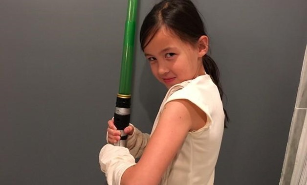 Abby, 9, poses in her Halloween costume as Star Wars' heroine Rey in Maplewood, New Jersey, U.S. October 23, 2017. Picture taken October 23, 2017. REUTERS/Barbara Goldberg