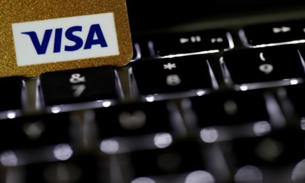 A Visa credit card is seen on a computer keyboard in this picture illustration taken September 6, 2017 -
 REUTERS/Philippe Wojazer/Illustration
