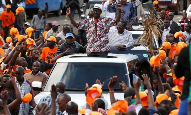 Kenyan opposition leader Raila Odinga, the presidential candidate of the National Super Alliance (NASA) coalition, greets his supporters during a rally at the Uhuru Park in Nairobi, Kenya October 25, 2017. REUTERS