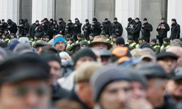 Police and national guard secure an area around the Ukrainian parliament building during a rally of opposition protesters in Kiev - REUTERS
