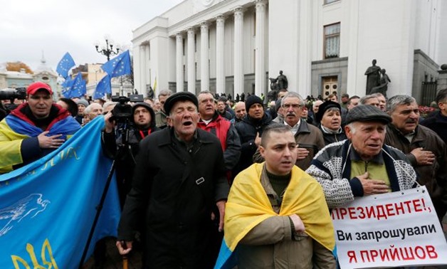Demonstrators attend a rally of opposition protesters in front of the Ukrainian parliament in Kiev - REUTERS