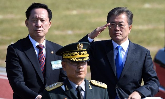South Korean President Moon and Defense Minister Song review the troops during a commemoration ceremony marking South Korea's Armed Forces Day - REUTERS
