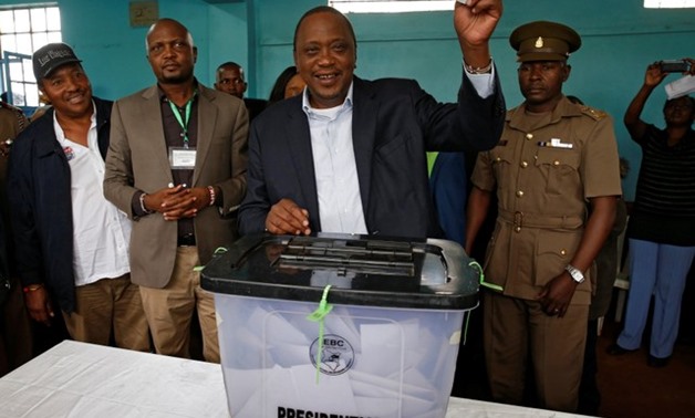 Kenya's President Uhuru Kenyatta casts his vote during a presidential election re-run in Gatundu - REUTERS