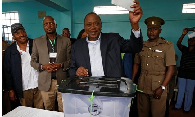 Kenya's President Uhuru Kenyatta casts his vote during a presidential election re-run in Gatundu - REUTERS