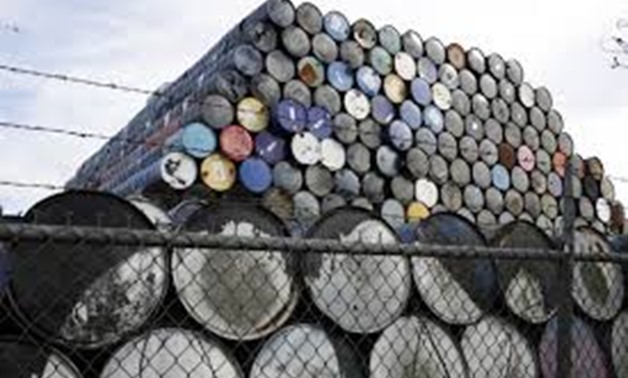 Used oil barrels are stacked at a storage facility in Seattle, Washington February 12, 2015. REUTERS/Jason Redmond