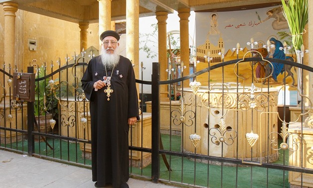 Father Abanoub of the Samannud church at the sacred well – Mahmoud Fakhry