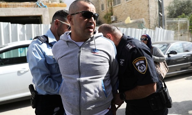Israeli policemen detain a Palestinian during a demonstration against the Balfour Declaration, on the centenary of the Balfour Declaration, outside the British Consulate in Sheikh Jarrah, East Jerusalem - REUTERS
