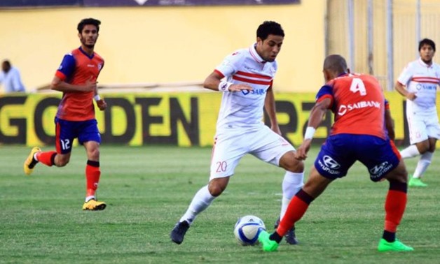 Zamalek`s Mohamed Ibrahim trying to beat Petrojet`s defender, Press Courtesy