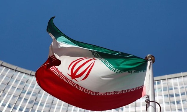 An Iranian flag flutters in front of the United Nations headquarters in Vienna - REUTERS/Heinz-Peter Bader