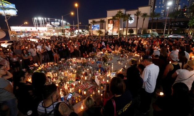Hundreds of people attend a vigil marking the one-week anniversary of the October 1 mass shooting in Las Vegas, Nevada U.S. October 8, 2017 - REUTERS/Las Vegas Sun/Steve Marcus