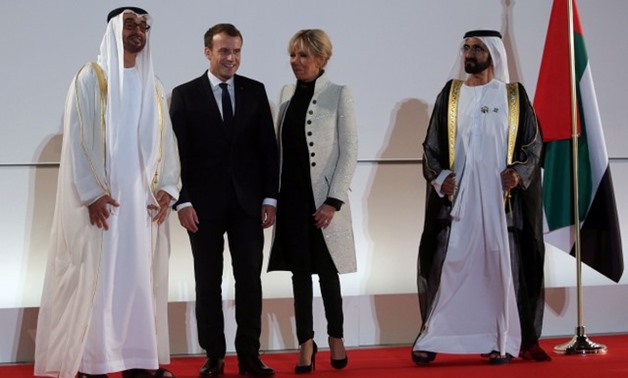 Sheikh Mohammed bin Zayed al-Nahyan, Emmanuel Macron, Brigitte Macron and Sheikh Mohammed bin Rashid al-Maktoum pose for a photo at the Louvre Abu Dhabi, in Abu Dhabi - REUTERS