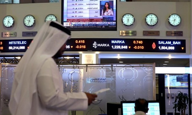 Traders monitor stock information at Dubai Financial Market, in Dubai, United Arab Emirates, June 5, 2017. REUTERS
