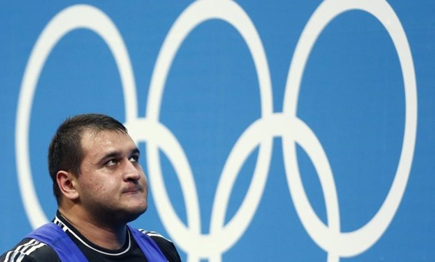 Russia's Ruslan Albegov reacts after failing a lift attempt during the men's +105kg Group A clean and jerk weightlifting competition at the ExCel venue during the London 2012 Olympic Games August 7, 2012. REUTERS/Dominic Ebenbichler