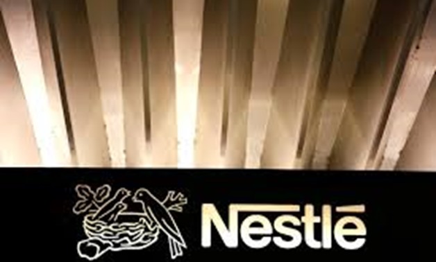 The Nestle logo is pictured on the company headquarters entrance building in Vevey, Switzerland February 18, 2016. REUTERS/Pierre Albouy/File Photo