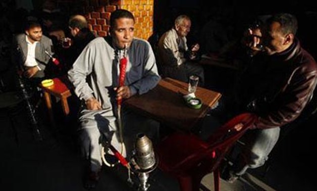 Egyptian at a cafe - Reuters