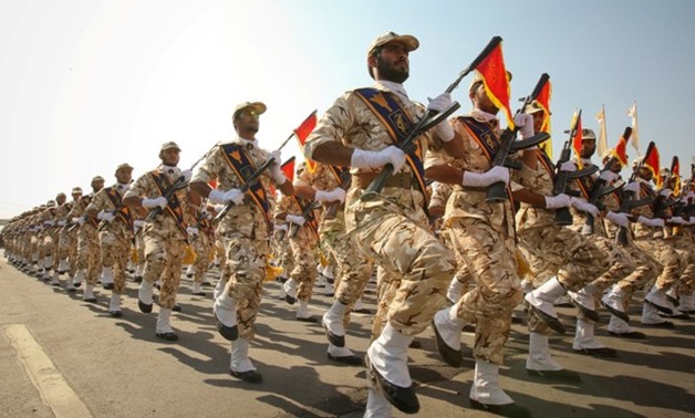 Members of the Iranian revolutionary guard march during a parade to commemorate the anniversary of the Iran-Iraq war (1980-88), in Tehran September 22, 2011. REUTERS/Stringer
