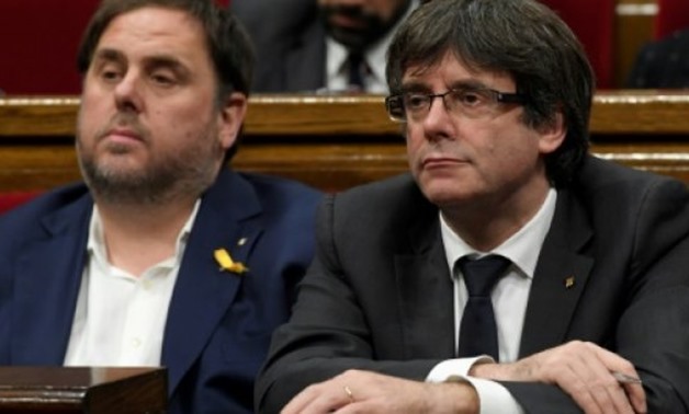 Carles Puigdemont (right) and Oriol Junqueras during a session of the Catalan parliament on October 26, 2017 -  AFP