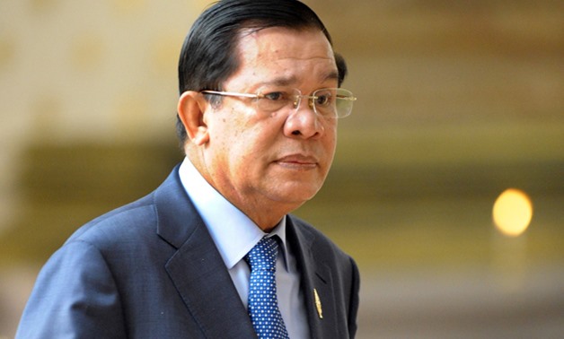 Cambodian Prime Minister Hun Sen walks into a National Assembly meeting in Phnom Penh - AFP