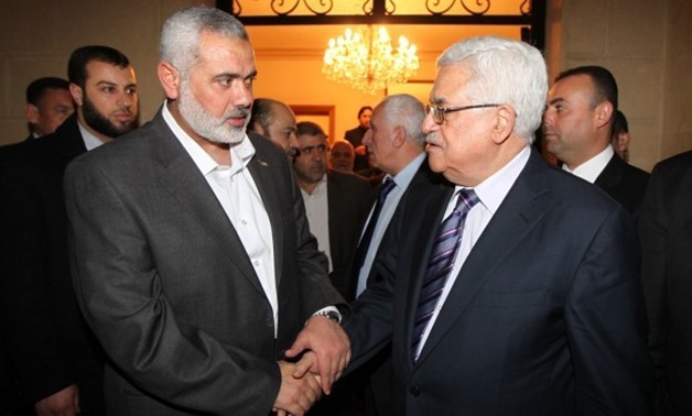Hamas's leader Ismail Haniyeh (L) and Palestinian President Mahmoud Abbas - Press Photo