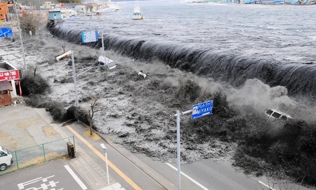 A wave approaches Miyako City from the Heigawa estuary in Iwate Prefecture after the magnitude 8.9 earthquake struck the area, March 11, 2011. REUTERS/Mainichi Shimbun

