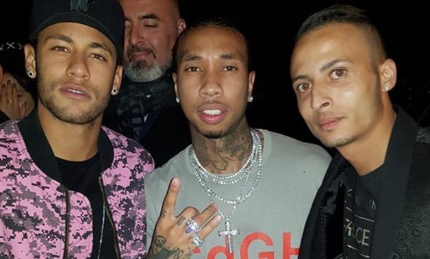 Neymar (left) and Tyga (centre) were pictured on the Imperio Club's Facebook page