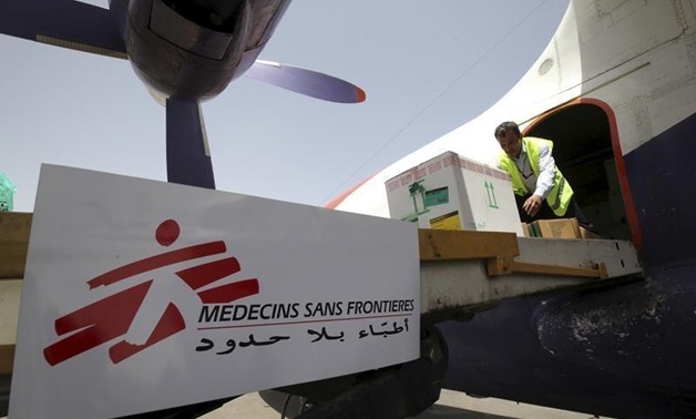 workers unloading emergency medical aid from Medecins Sans Frontieres from a plane at Sanaa airport, April 13, 2015. REUTERS/Mohamed al-Sayaghi